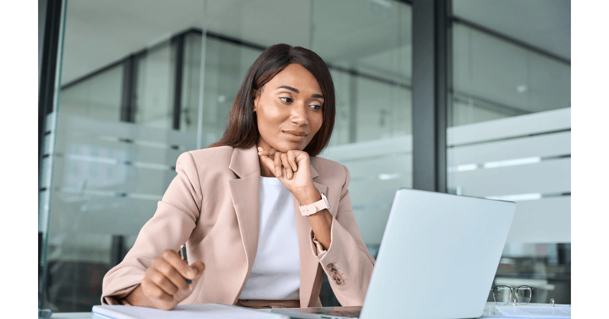 Professional watching a webinar and taking notes